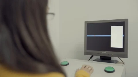 Screen of Drivers Testing Machine in Clinic. Female Behind Controls, Close Stock Footage 113051745