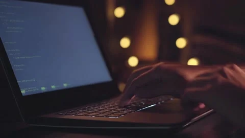 Screen full of code in real time Extreme close-up human hands. Closeup coding on Stock Footage 334586539