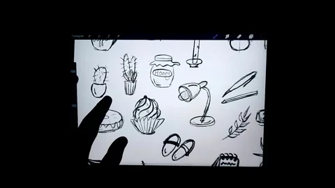 On screen of gadget there is digital drawing of small elements in doodle style Stock Footage 254954900