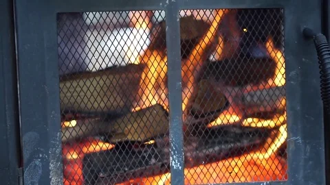 Screen Grate Front Fireplace Wood Logs Burning Fire Red Flames Video stock 71472742