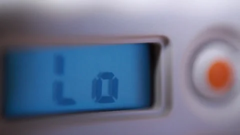 Screen indicators of electronic thermometer. Macro Stock Footage 86056029