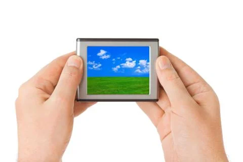 Screen with landscape in hands Stock Photos