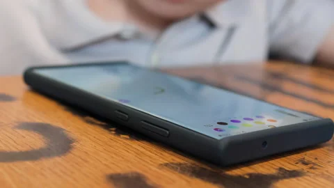 Screen of lighting phone lies on table. Stock Footage 288093757