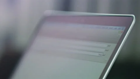 Screen of modern laptop with website on blurred background Stock Footage 230037836
