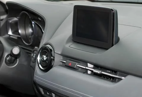 Screen multimedia system on dashboard in a modern car Stock Photos
