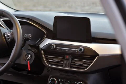 Screen multimedia system on dashboard in a modern car Stock Photos