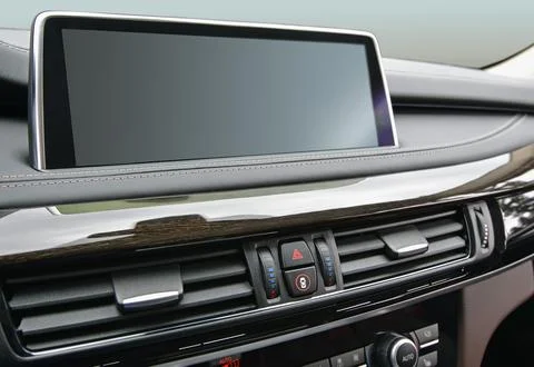 Screen multimedia system on dashboard in a modern car Foto stock