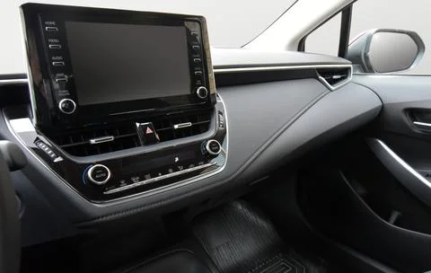 Screen multimedia system on dashboard in a modern car Stock Photos