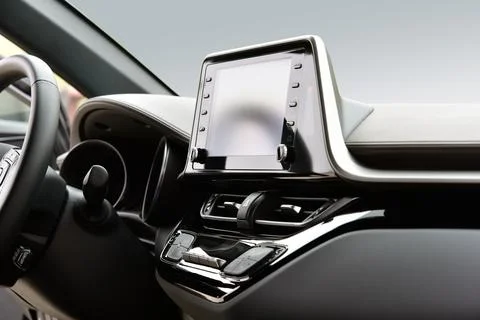 Screen multimedia system on dashboard in a modern car Stock Photos