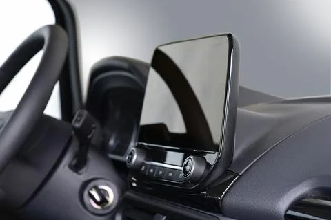 Screen multimedia system on dashboard in a modern car Stock Photos