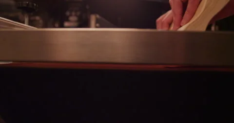 Screen printer screen prints a tee shirt from the side Stock Footage 248324215