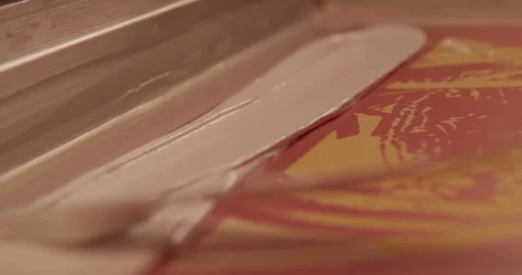 Screen printer spreads ink for tee shirt printing Stock Footage 248324492