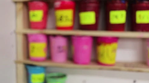 Screen printing ink red pink blue on shelf. Blue and brown wood shelf. Stock Footage 139387420