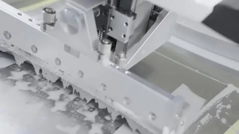 Screen printing machine squeegee moves over circuit board Vídeos de archivo 348171172