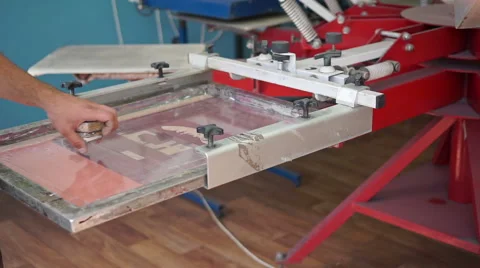 Screen printing manufacturing on t-shirts Stock Footage 66420186