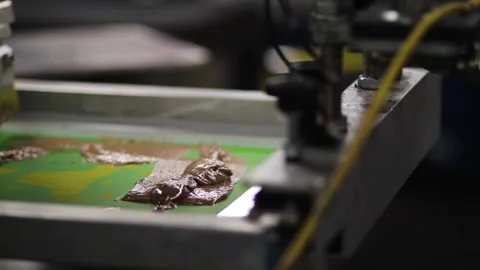 Screen printing press with silk screen and brown ink or paint. Stock Footage 139387394