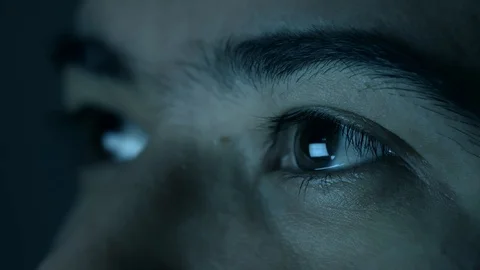 Screen reflected on man's eyes looking up. Stock Footage 101783353