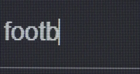 Screen search bar text typing: football news Stock Footage 265461060