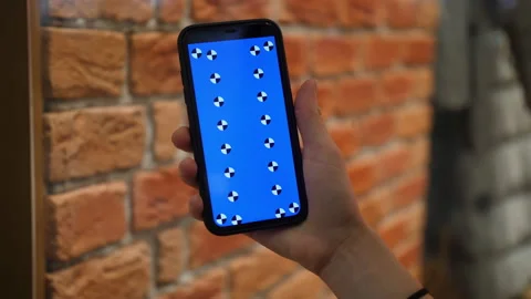 The screen of the smartphone against the background of the kerpic wall. Stock Footage 170186110