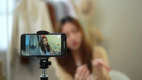 Screen smartphone attractive young influencer woman share makeup tutorials. Stock Footage 246731079