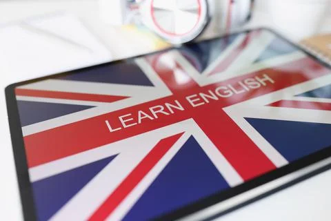 Screen tablet device shows learning english language online program Stock Photos