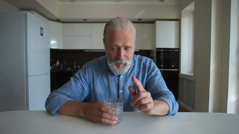 Screen view POV smiling senior aged male drinking fresh water and talking on 스톡 동영상 249352705