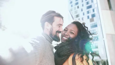 Screen view of a tourist mutiethnic young couple doing a selfie video kissing Stock Footage 221467184