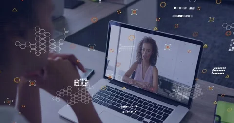 On-screen woman gesturing and emphasizing points, driving HUDs rising on laptop 動画素材 330379862