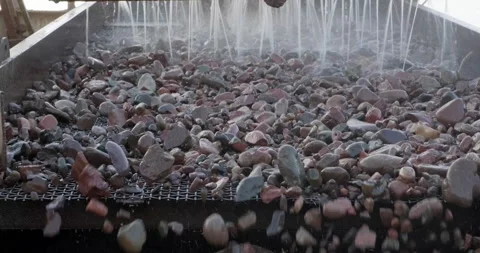 Screening and washing in open-pit mining. Sorted rocks move on conveyor belt in Stock Footage 290119409