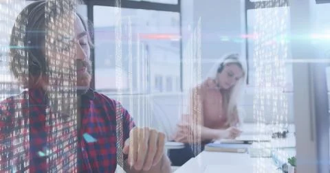 Screens with data processing against caucasian man wearing phone headset working Stock Photos