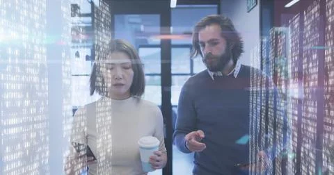 Screens with data processing against diverse male and female office colleagues Stock Photos