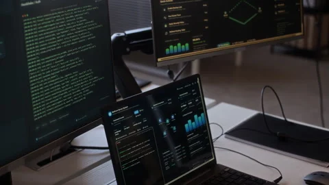 Screens with Programming Codes and Digital Interface on Computers in Office 스톡 동영상 334928298