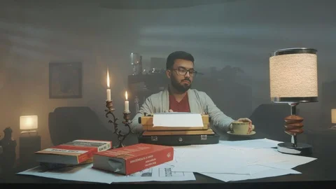 Screenwriter thinks how to write a screenplay and drink cofe Stock Footage 127119250