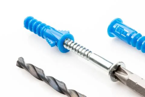 Screw with anchor and drill bits for hollow walls. Stock Photos