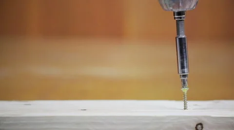 Screw and an electric screwdriver Stock Footage 63433044