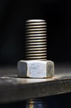 Screw and nut on metallic surface Stock Photos