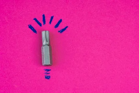Screw bit as a idea on pink Stock-Fotos
