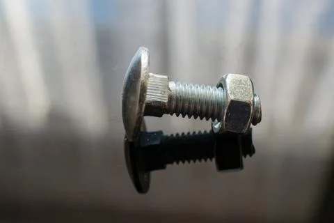 Screw on a Black Background. Stock Photos