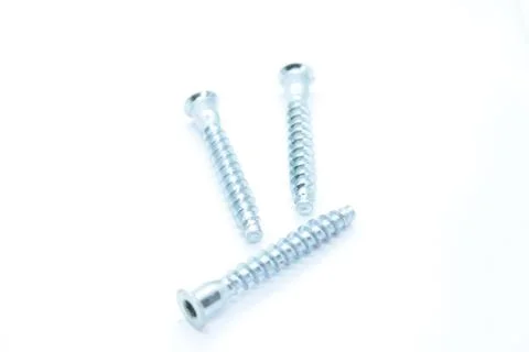 Screw bolt located on a white background Stock Photos