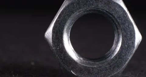 Screw close-up on a dark background. Fastener full face. 動画素材 165265849