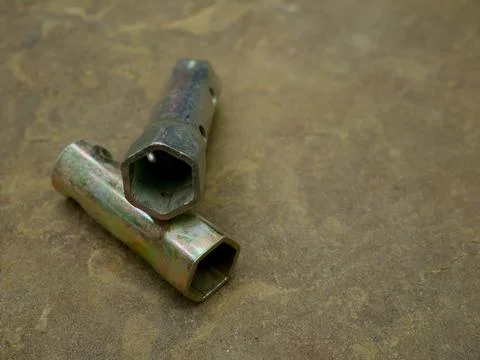 Screw connector hardware tool presented on stone surface for industrial backg 스톡 사진