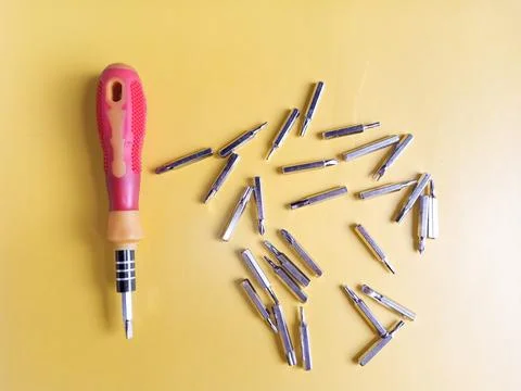 The screw-driver with a set of various nozzles. Interchangeable screwdriver.. Stock Photos