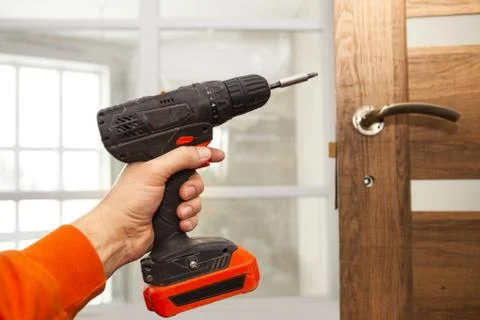 The screw gun in a hand Stock Photos