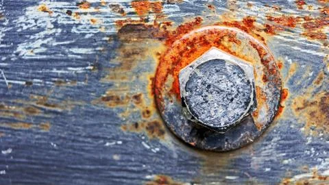 Screw head in a rusty surface Stock Photos
