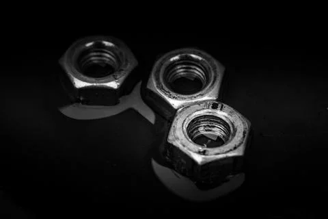 Screw-nuts in water, close up image, background Stock Photos