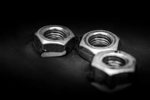 Screw-nuts in water, close up image, background Stock Photos