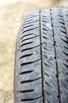 Screw puncturing tire Foto stock