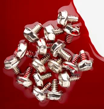 Screw in red Stock Photos