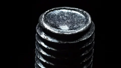 Screw in rotation on a black background. Video stock 99234147
