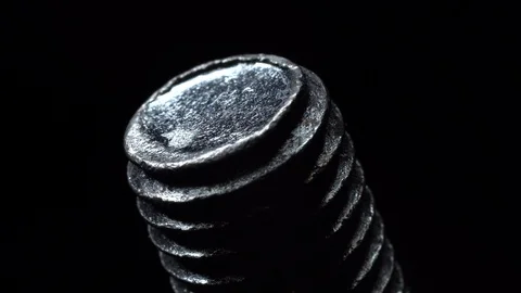 Screw in rotation on a black background. Stock Footage 99234378
